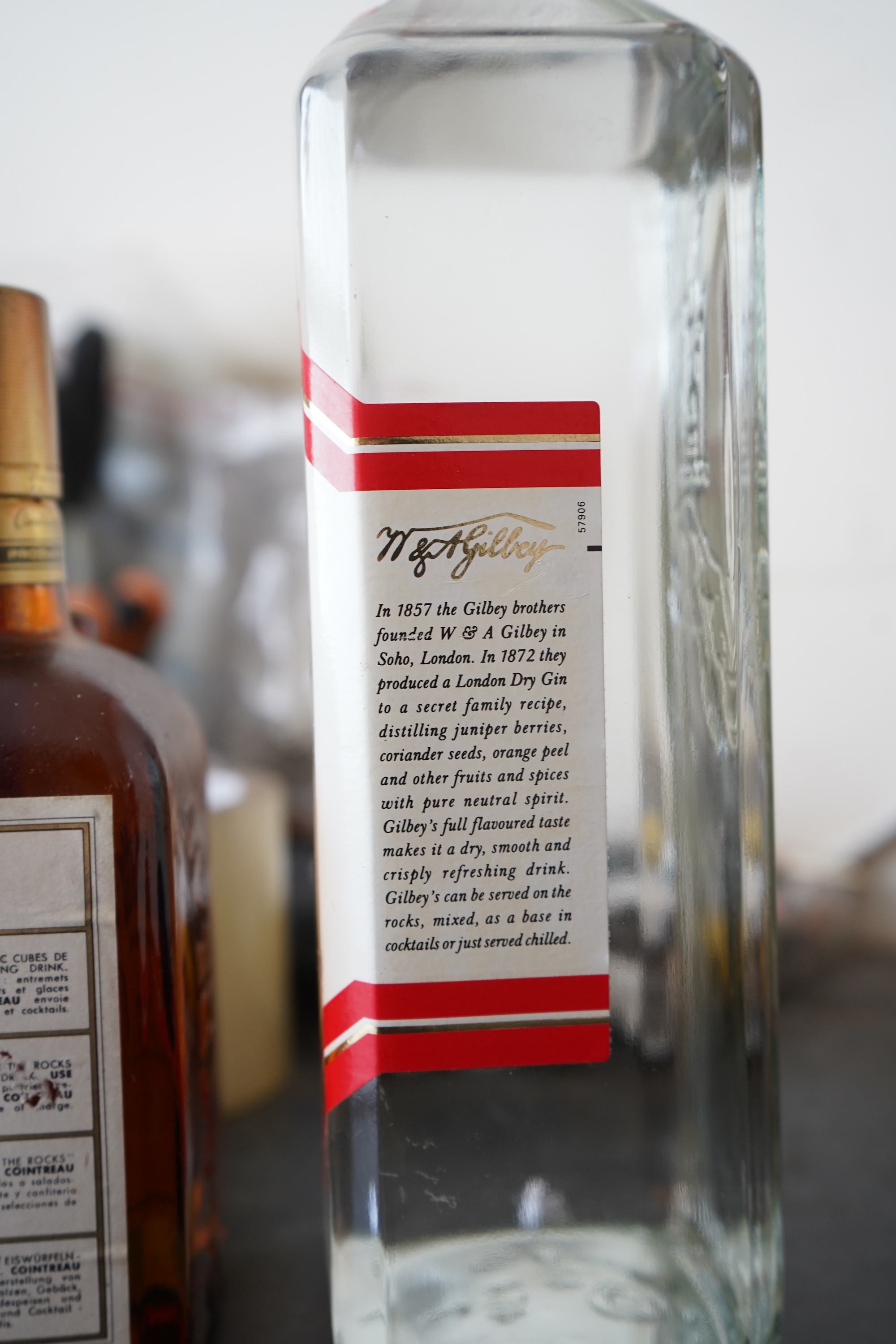 Six bottles of spirits and liqueurs, including whiskey and gin